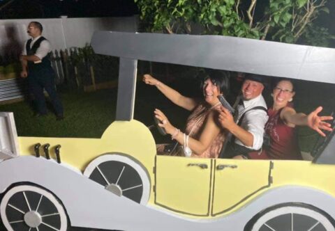 1920s murder mystery party game guest in costumes