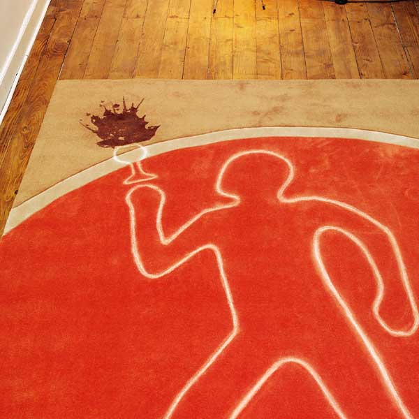 Crime scene-style decoration from 'A Deadly Vintage' murder mystery game featuring a wine glass spill outline on a rug.