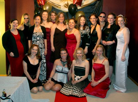 a group of women posing for a photo