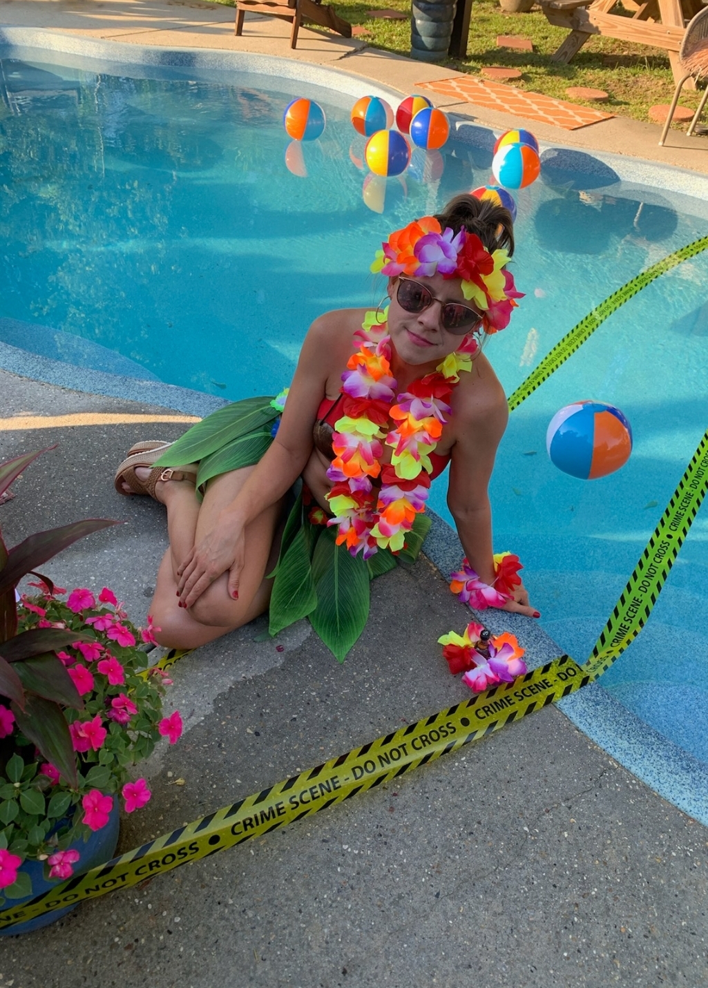 a person in a pool with flowers