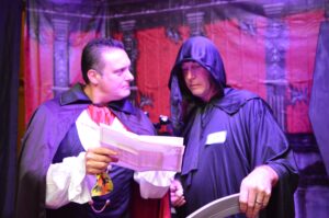 Two guests investigate each other at a murder msutery party