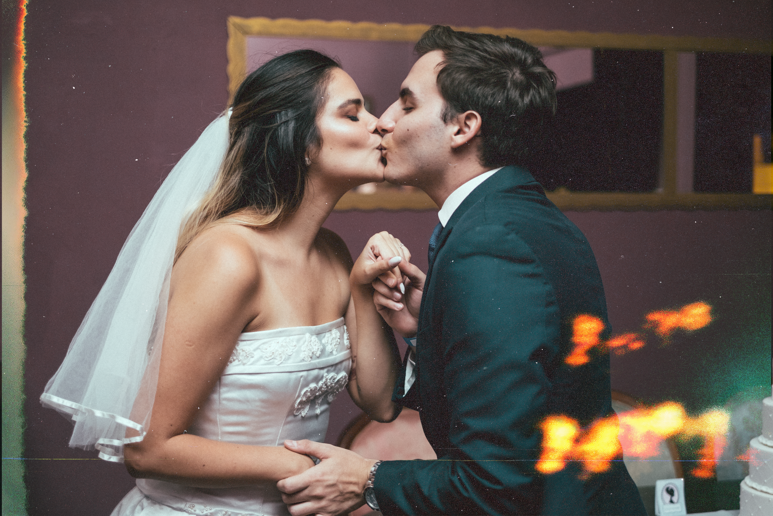 Night of Mystery | Party of the Month: Till Death Do Us Part — A Brazilian Wedding to Die For bride and groom kissing in an wedding themed mystery game