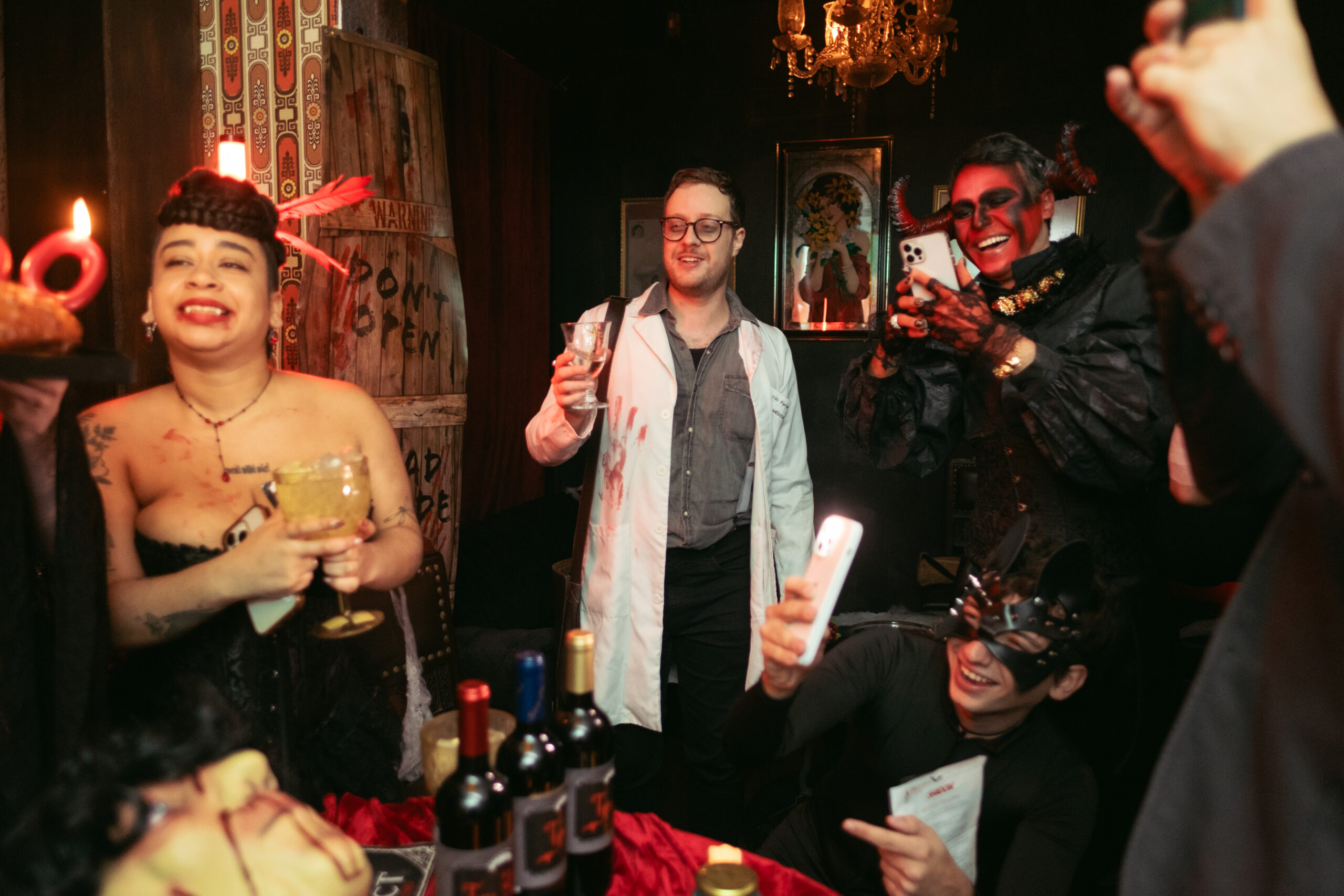 A Wall of Suspects featuring character mugshots, red string connections, and crime scene evidence for a villain mystery party.