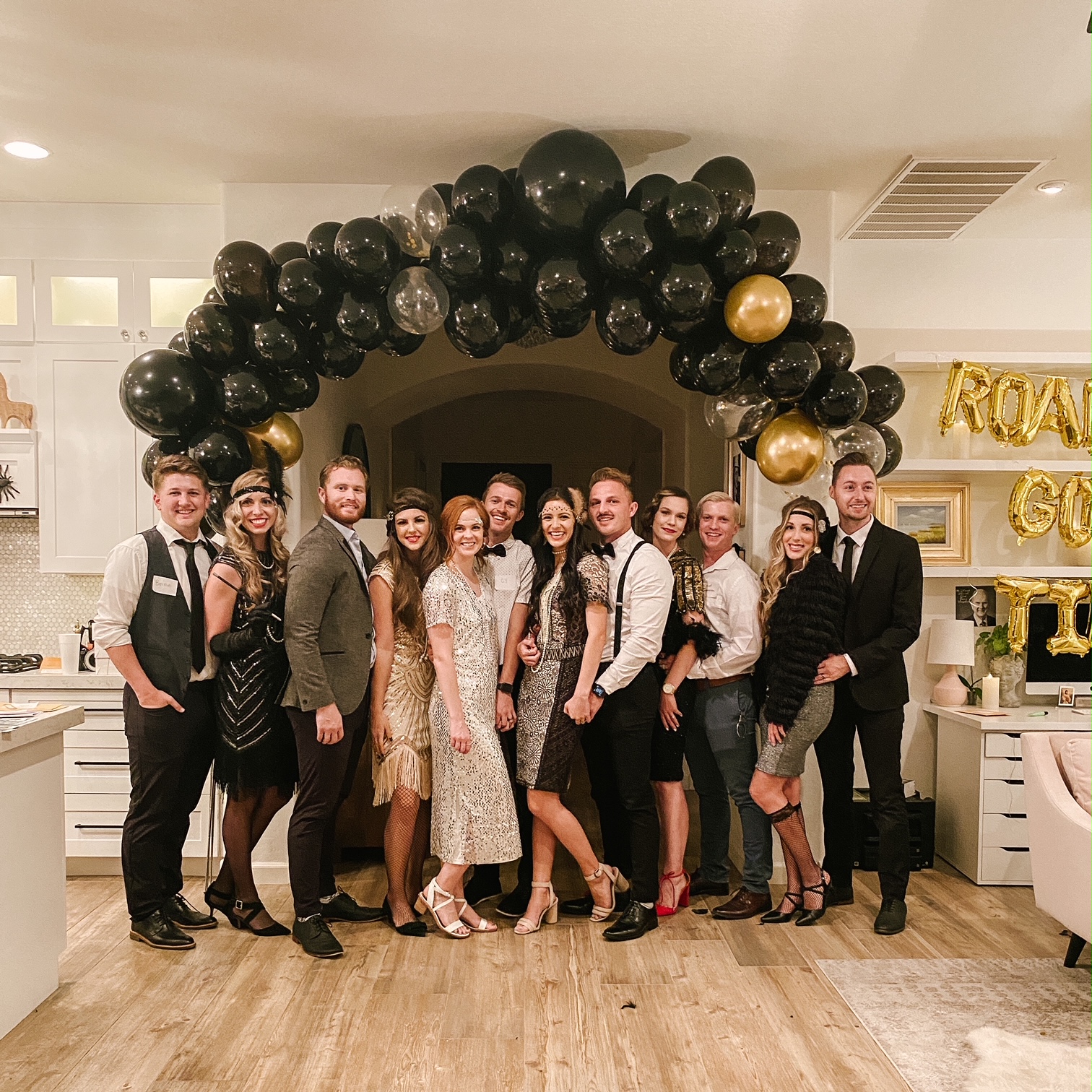 Night of Mystery | Roaring 20s Party Ideas: Decor, Outfits, Cocktails, And More guests at a great gatsby themed murder mystery party
