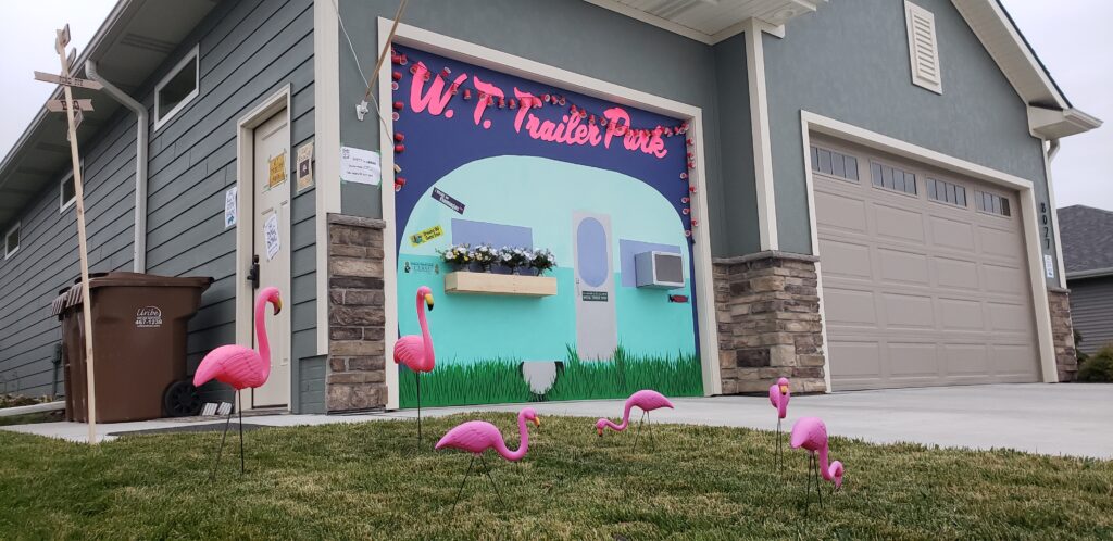 Painted garage decorated as a trailer park for a murder mystery party