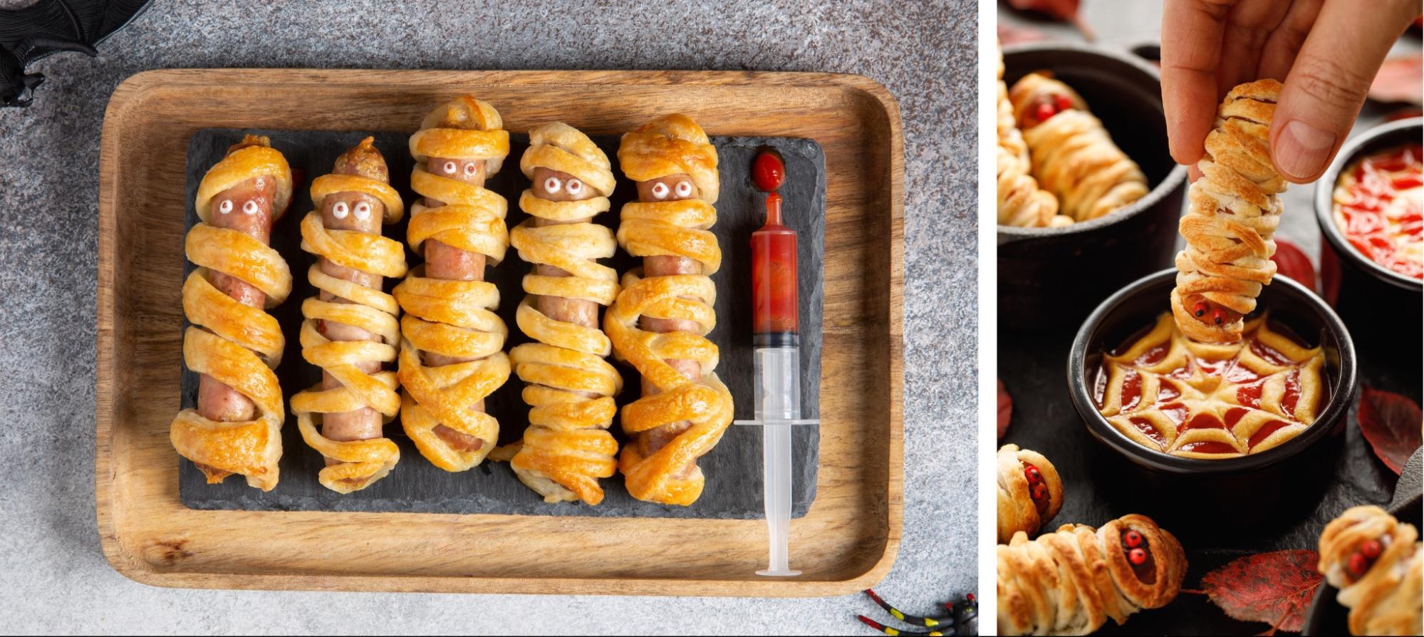 Mummy hot dogs on party serving tray.