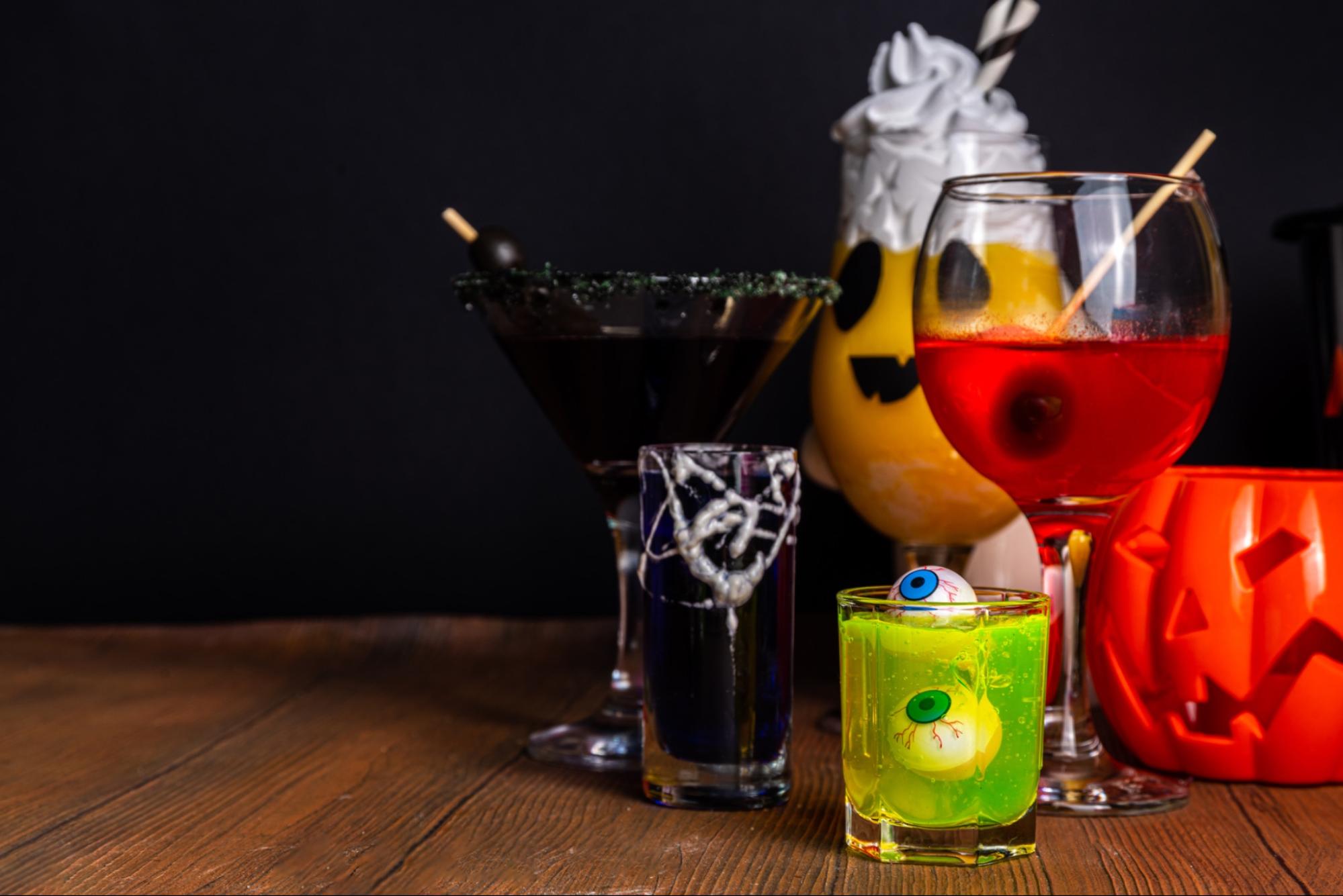 Black Halloween martini with red garnish called Black Widow.