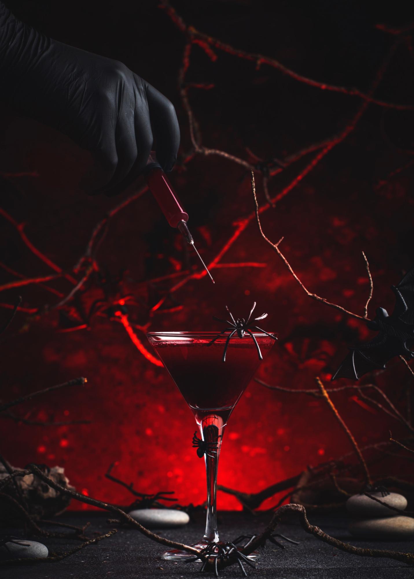 Halloween cocktails in black martini glasses.