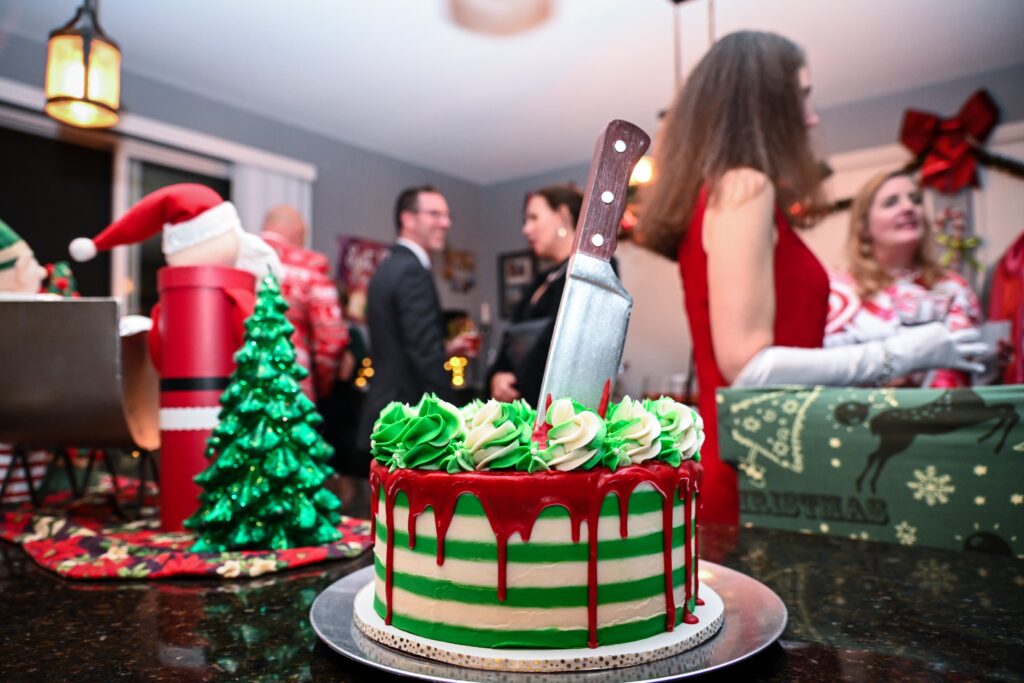 Festive holiday snacks and drinks arranged for a corporate office Christmas party with murder mystery theme.