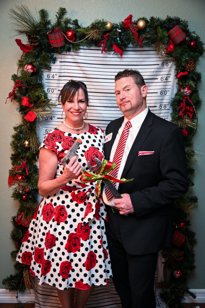 Colorful Christmas lights and garland set the mood for a mystery party.