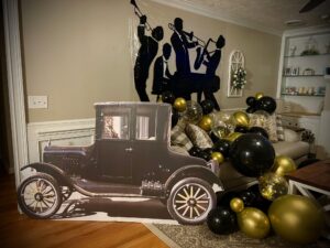 Night of Mystery | Murder Mystery Party Games Hub Gold and black decorations for a mystery-themed New Year’s Eve party