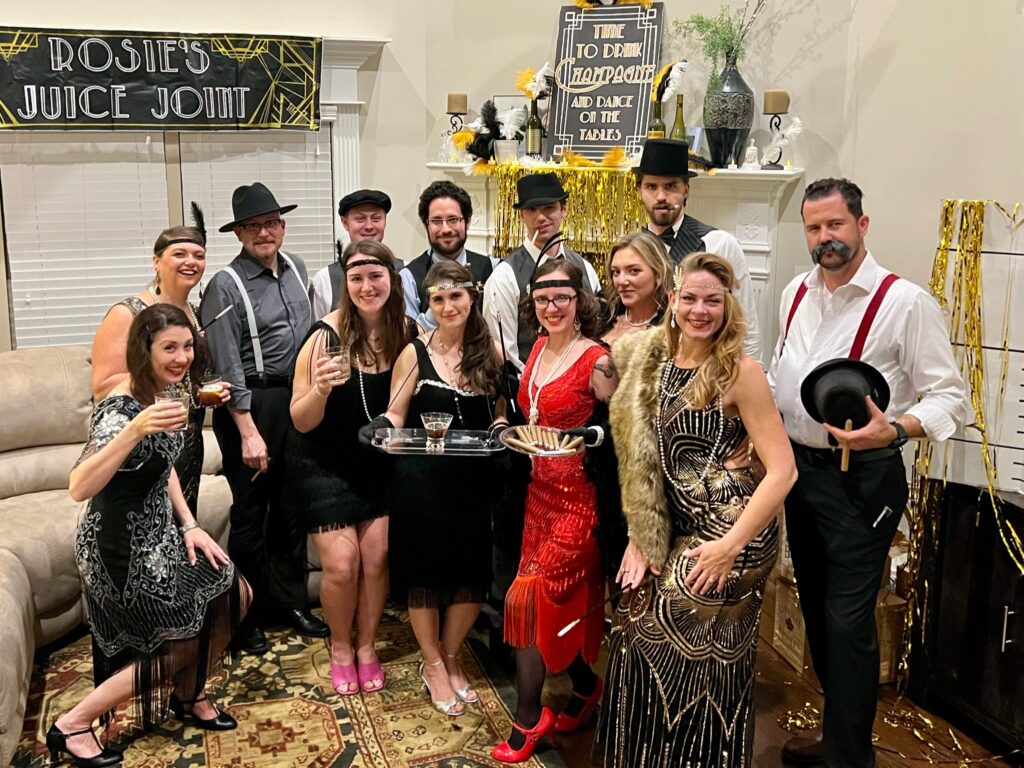 Group of friends celebrating at a New Year’s Eve mystery party