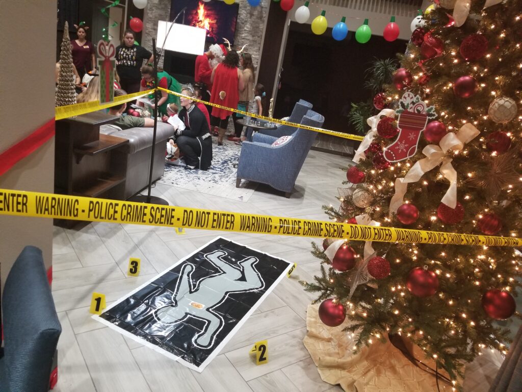 Christmas presents labeled with clues for a holiday mystery game.