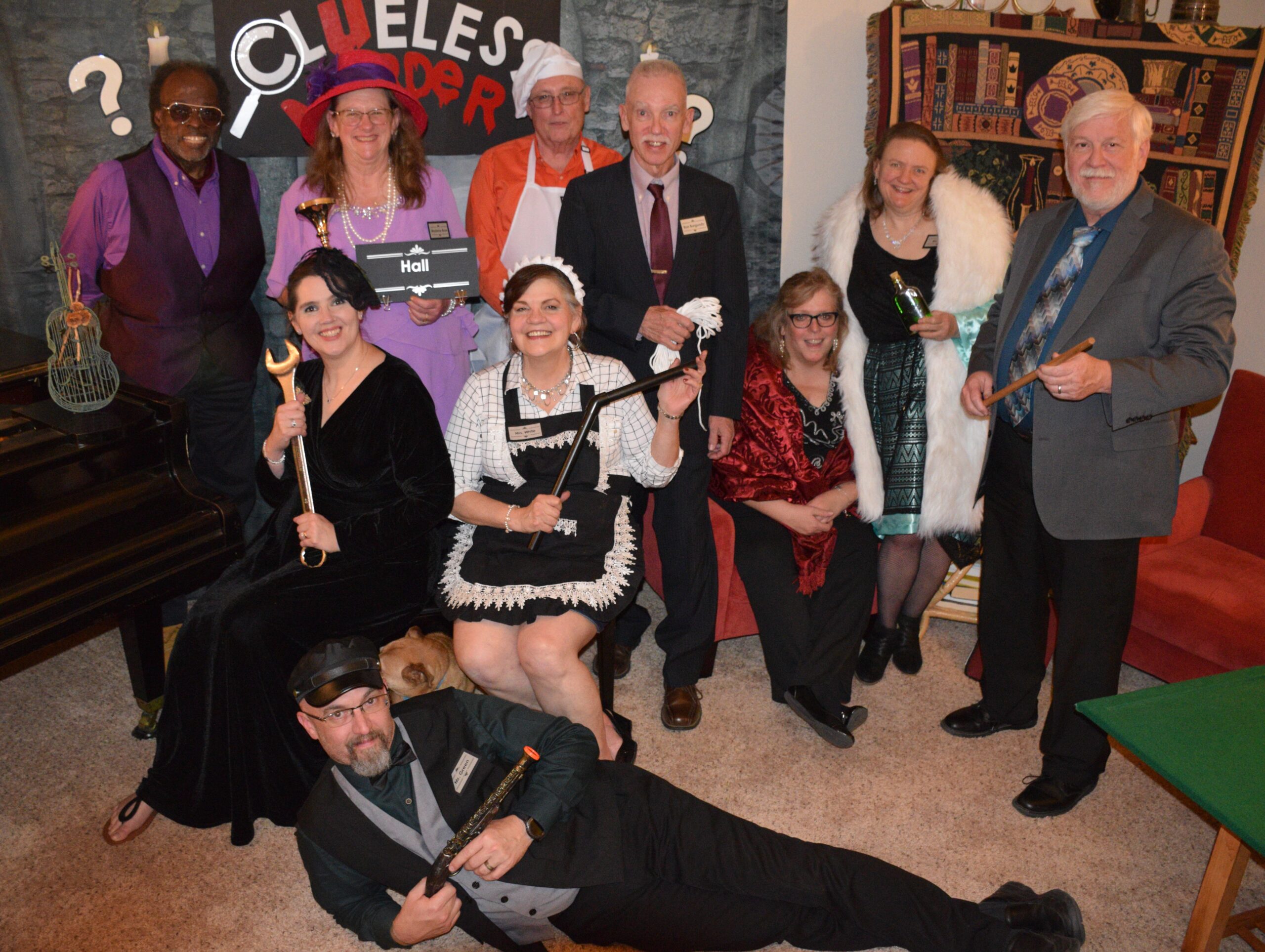 Guests in color-coded mansion mystery costumes inspired by A Clueless Murder.