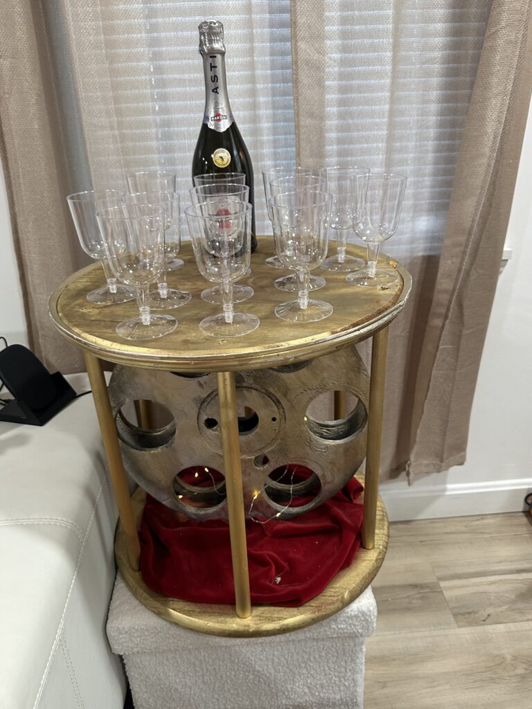 Gatsby themed champagne tower with gold and Art Deco décor
