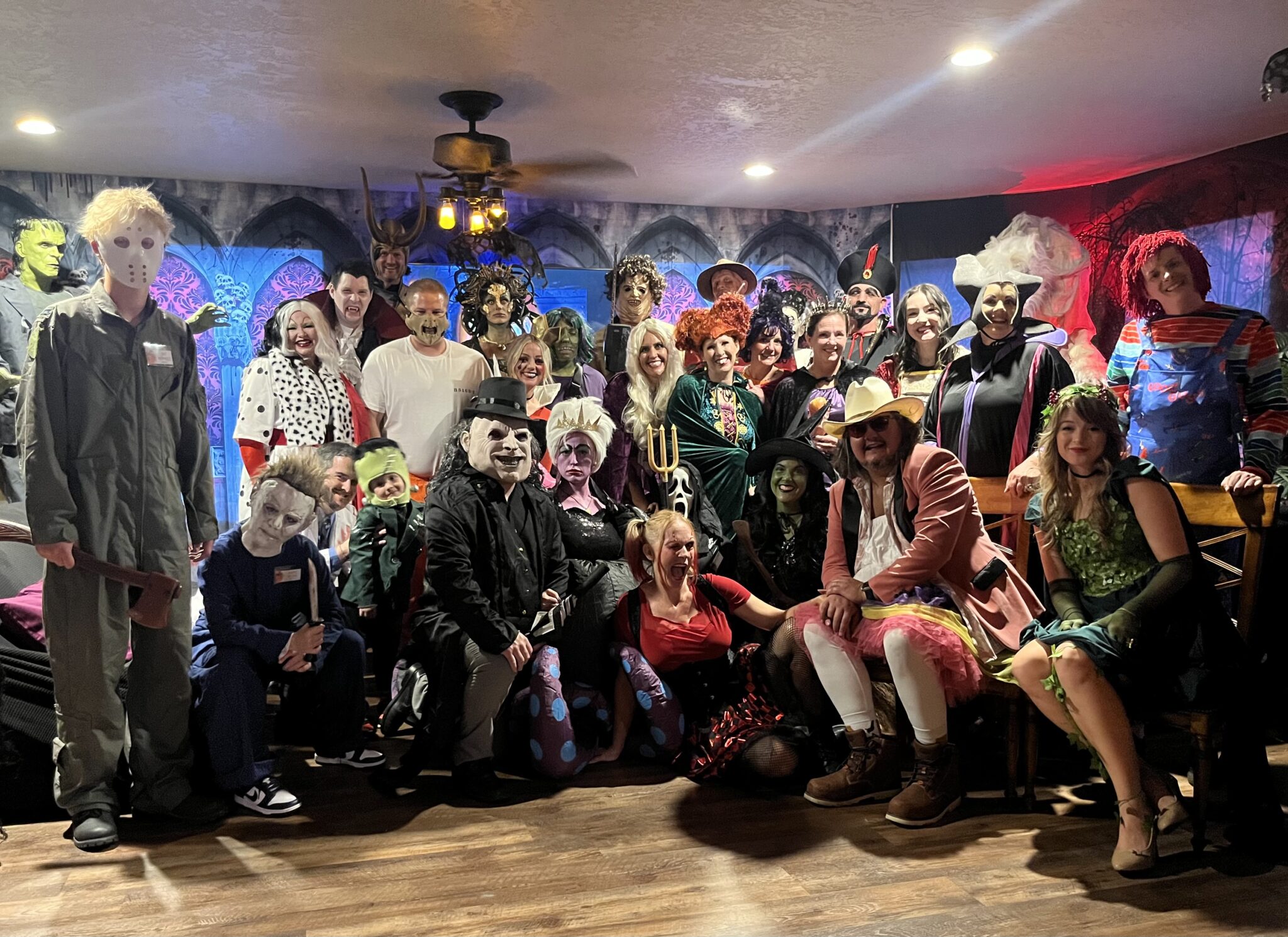 Guests dressed in costumes solving clues at a murder mystery party