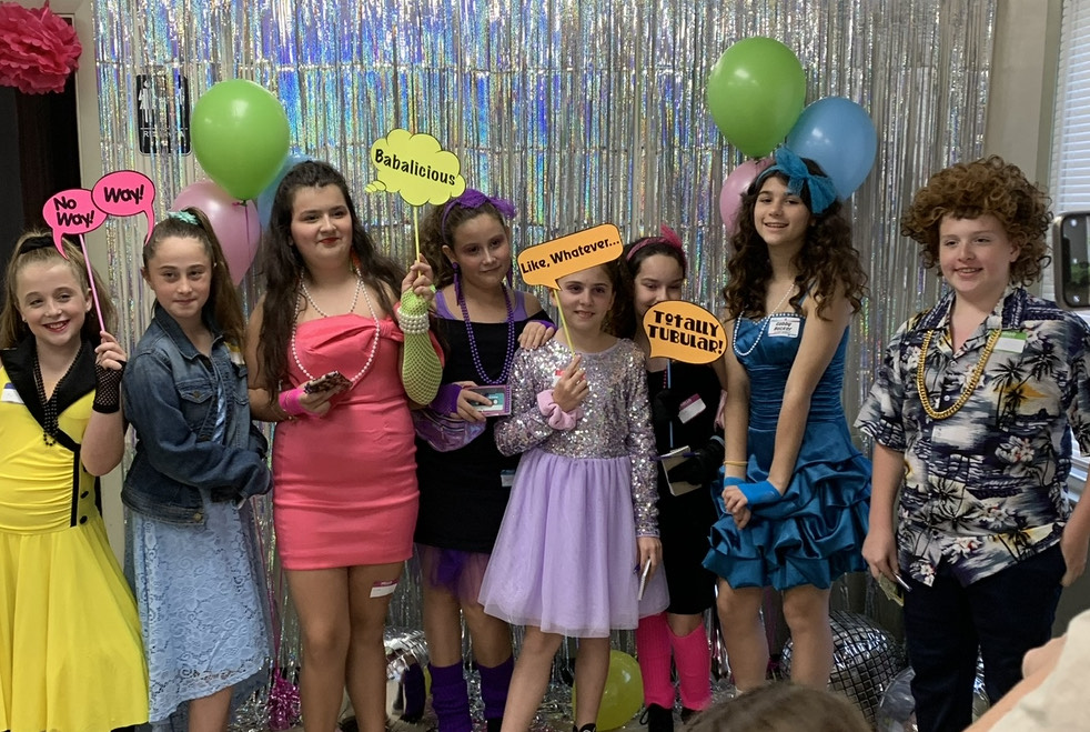 Teen and tween mystery party games being played at a birthday party