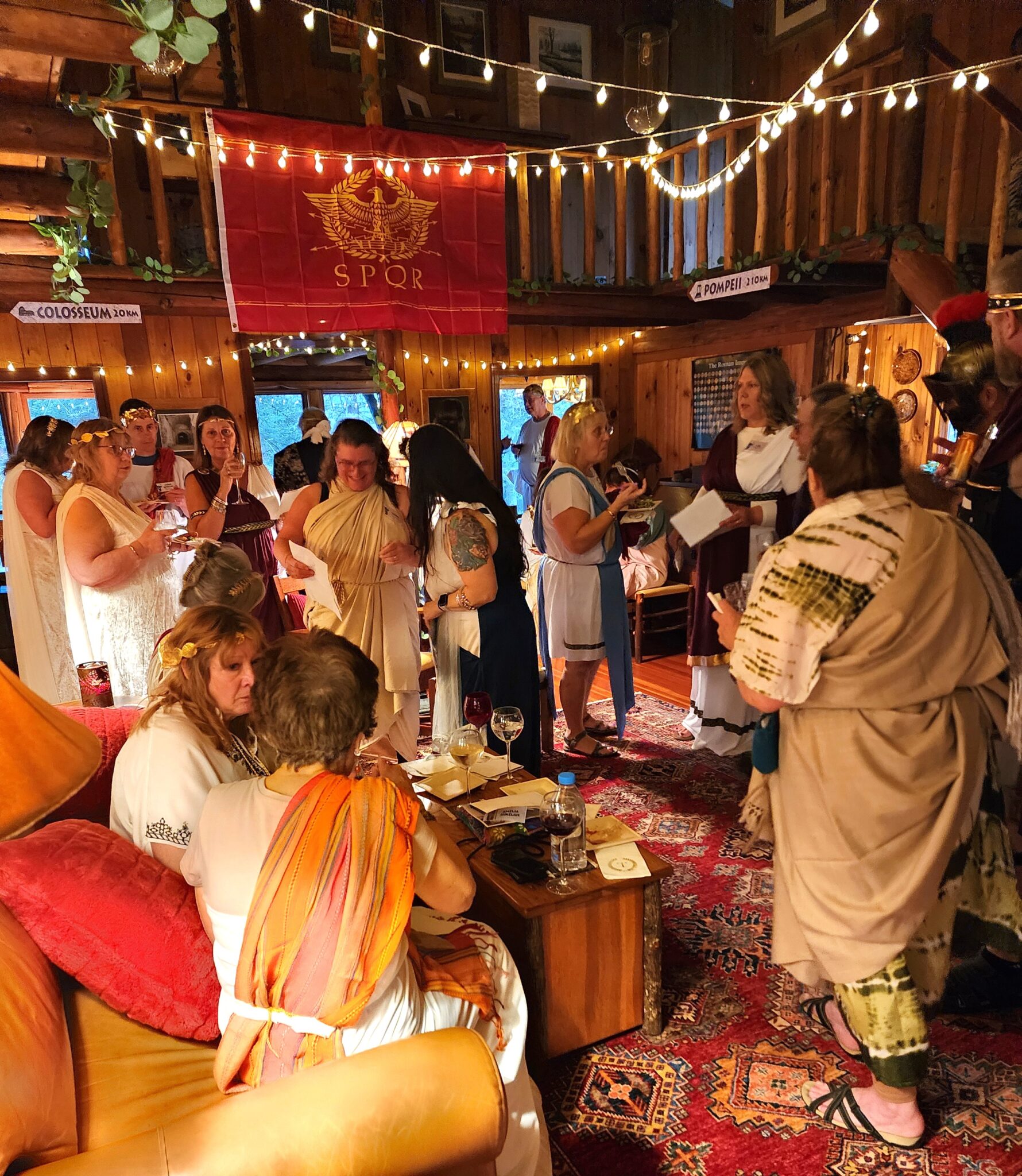 toga themed party set up and costumes