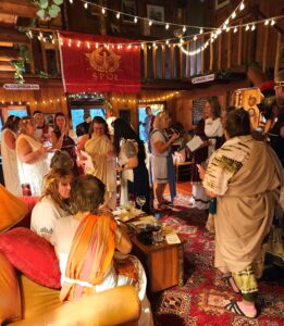 Night of Mystery | How to Host a Murder Mystery Dinner Party in 15 Steps toga themed party set up and costumes